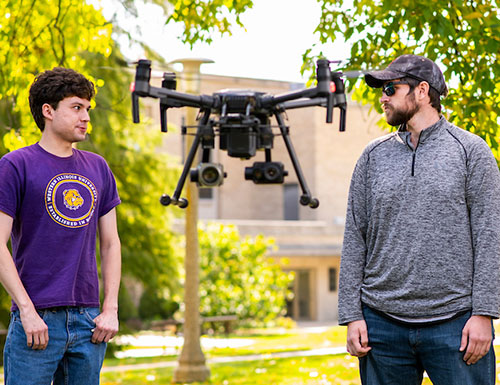 students working with a drone