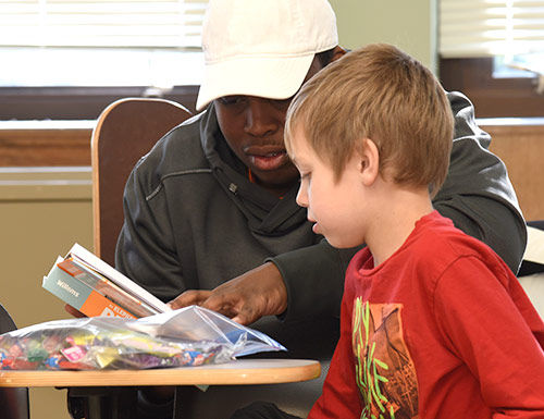 student reading to a child