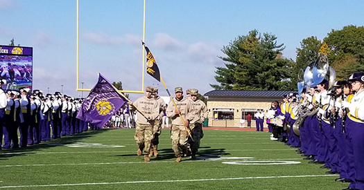ROTC Cadets running onto Hanson Field before a football game