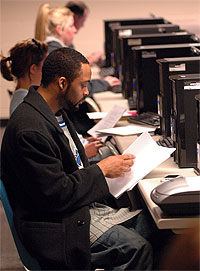 Student studying in  computer lab.