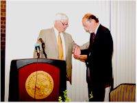 Macomb Mayor Mick Wisslead presents John Hallwas with Studs Terkel Award