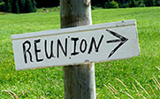 Photo of a sign with reunion and an arrow on it.