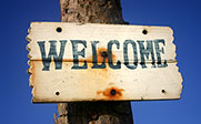 Image of a sign with the text Welcome