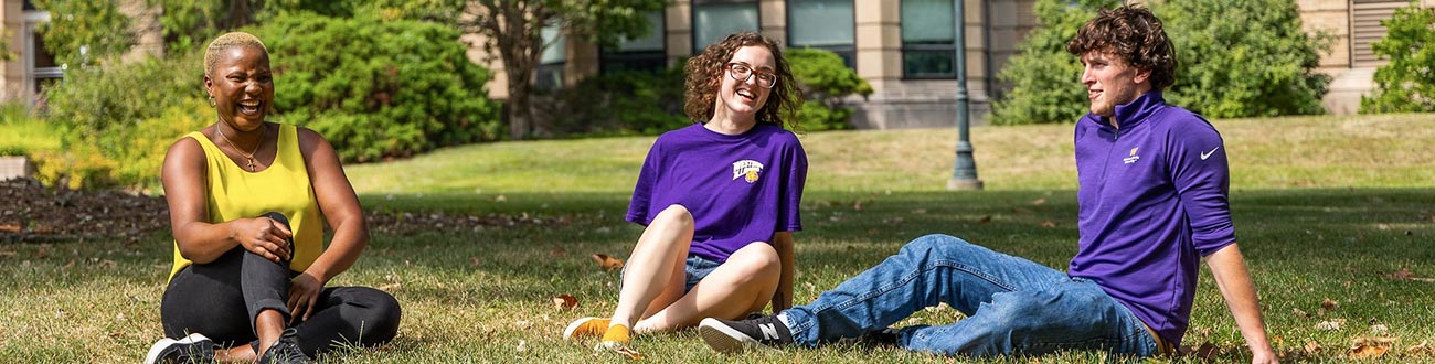 students sitting outside