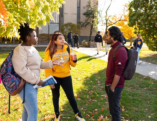 students talking outside