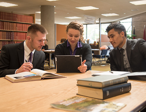 student working in the library