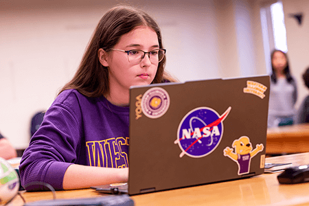 Student exploring majors on their laptop