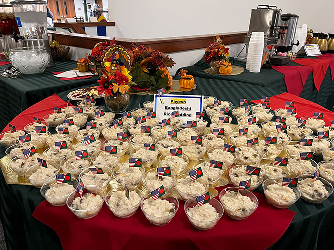 a table with many bowls of Payesh (Bangladeshi Rice Pudding)