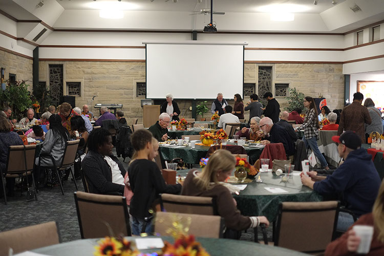 people at tables eating