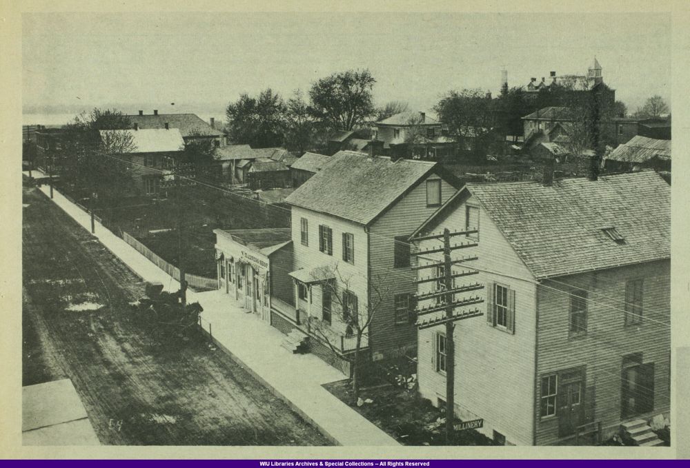 Elevated historic view of Icarian apartment houses and other buildings around Temple Square in Nauvoo.