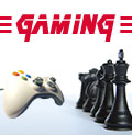 Photo of a video game controller facing chess pieces with the word gaming above them.