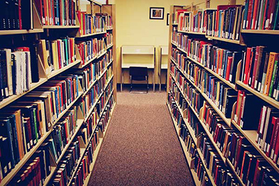 Books on bookshelf in library