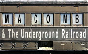 A train car with the words Macomb and the Underground Railroad on it.