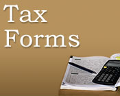 Photo of tax forms with a calculator and pencil.
