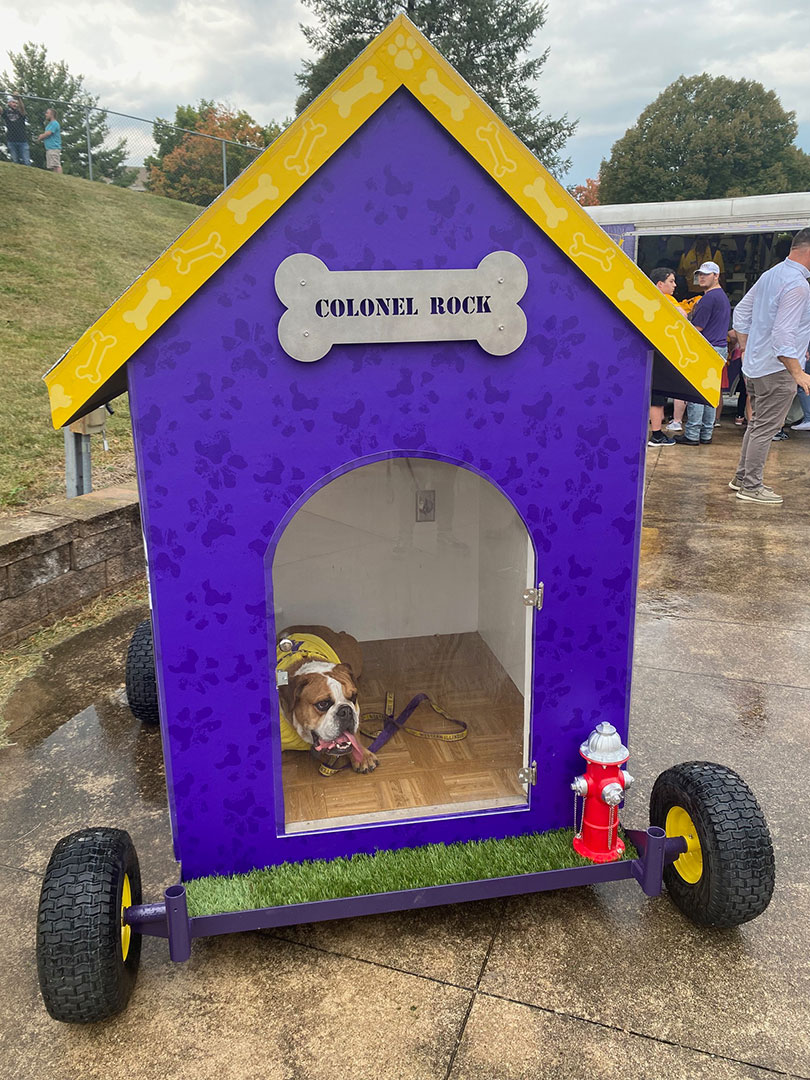 front of the Colonel's doghouse