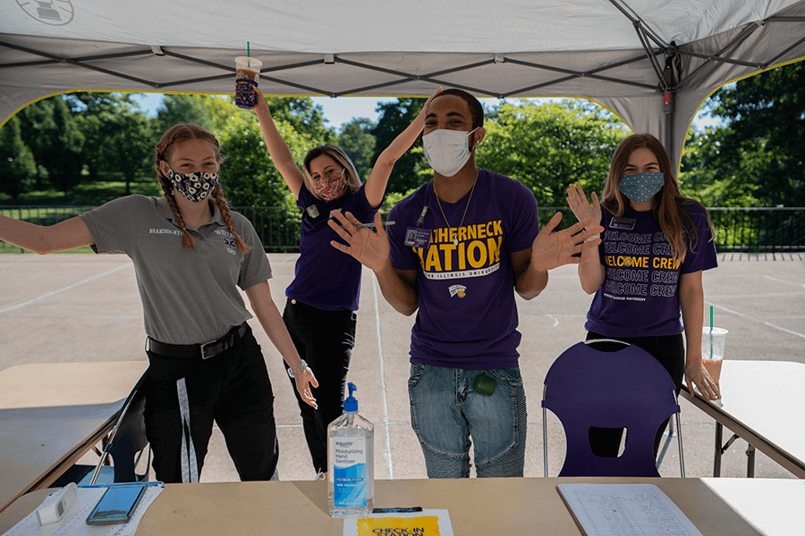 Photo of four move in crew members at a table