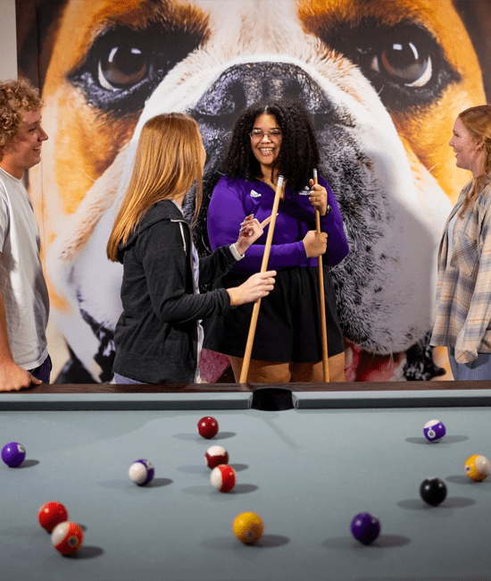Photo of students playing billiards