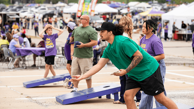 people playing corn hole