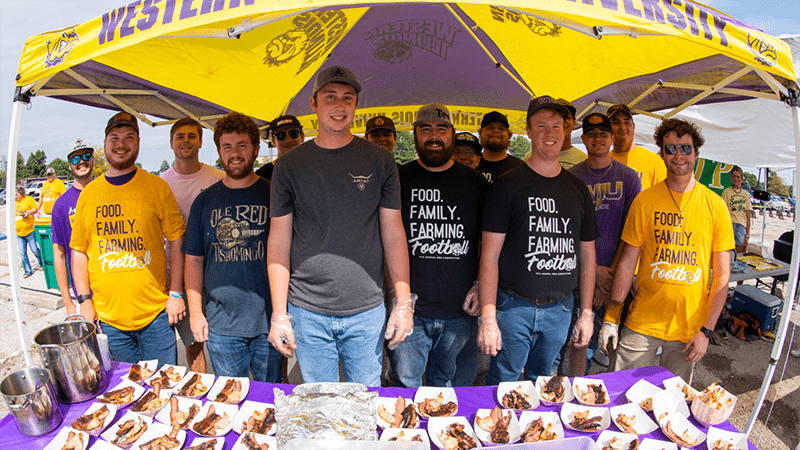 group of people in a tent displaying their bbq