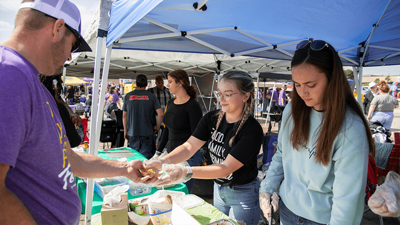 person being handed bbq